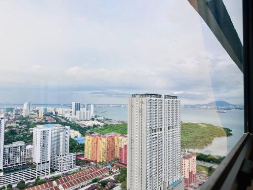 an aerial view of a city with buildings and water at New Urban Suite Majestics 3BR Homestay at Georgetown BY URBAN STAYCATION HENG LOD in Jelutong