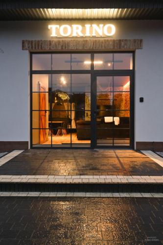 a front door of a furniture store with a window at Aparthotel Mamma Mia - Oświęcim in Oświęcim