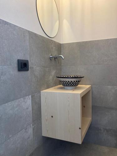 a bathroom with a sink and a mirror at La mansardina in Padova