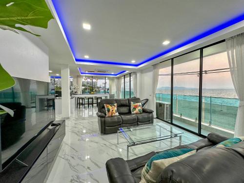 a living room with a view of the ocean at STUNNING BEACHFRONT VIEW LUXURIOUS Apartment 30 in Jomtien Beach