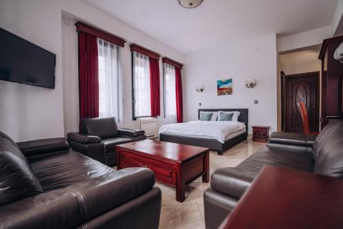 a living room with a couch and a bed at Lihnidos Square in Ohrid
