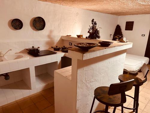 a kitchen with a sink and a counter with a sink at Villa sul Mare Calalunga Calasetta Sant Antioco in Calasetta