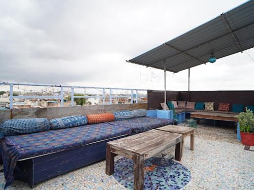 a large couch sitting on top of a roof at Yogis Guest House in Jodhpur