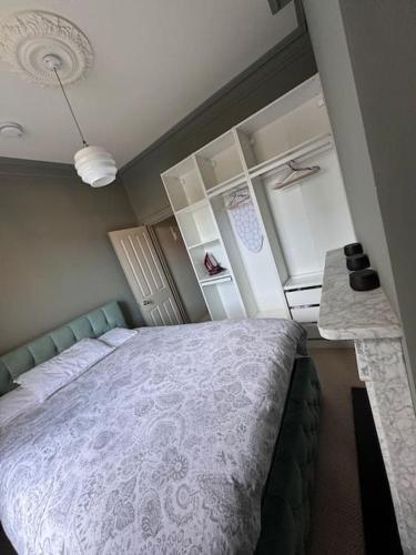 a bedroom with a large bed and a counter at Luxury Apartment, Old Town - Hastings in Hastings