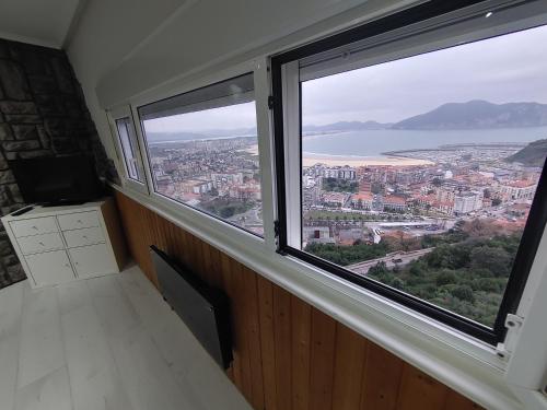 a room with a large window with a view at Torre de laredo 9-3 in Laredo