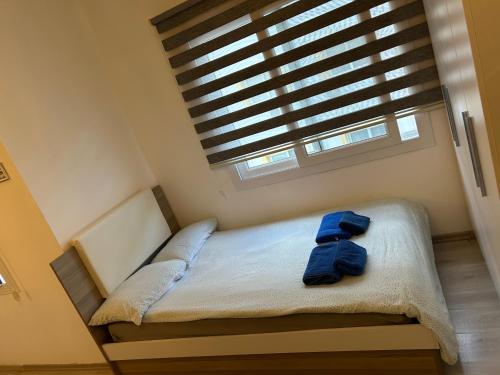a small bed in a room with a window at New studio no2 in the middle off famagusta & NETFLIX in Famagusta