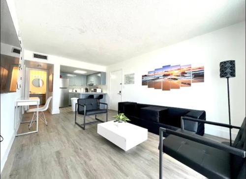 a living room with a couch and a table at Miami International Airport 2 in Miami