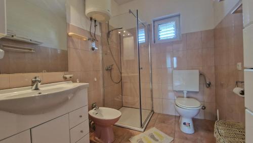 Kúpeľňa v ubytovaní Apartman LAURA 1