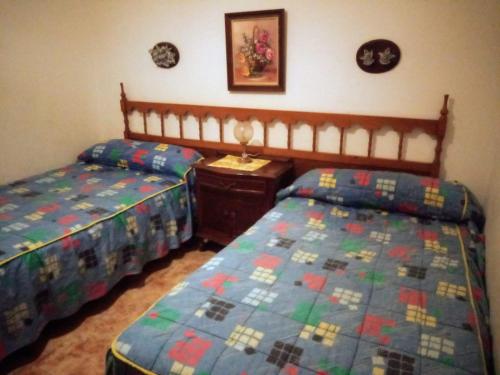 מיטה או מיטות בחדר ב-Piso de 4 habitaciones