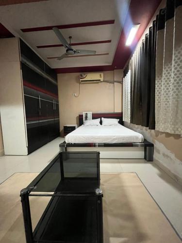 a bedroom with a bed and a table in it at Private room in apartment in Mire