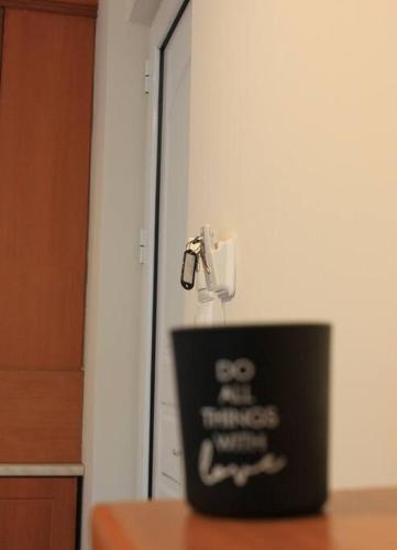 a black container sitting on a table in front of a door at John's House 1 in Diakopto