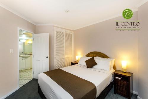 A bed or beds in a room at Il Centro Apartment Hotel