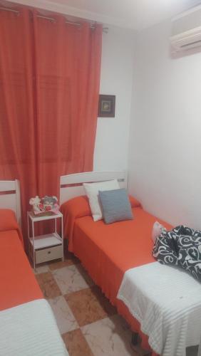 Ein Bett oder Betten in einem Zimmer der Unterkunft Villa Pilarin