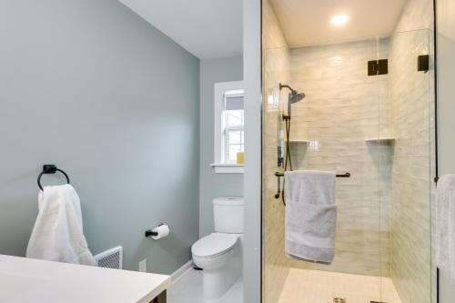 a bathroom with a toilet and a glass shower at Orange Cottage with Hiking Access 1 Mi to Lake Anna in Kirk O'Cliff
