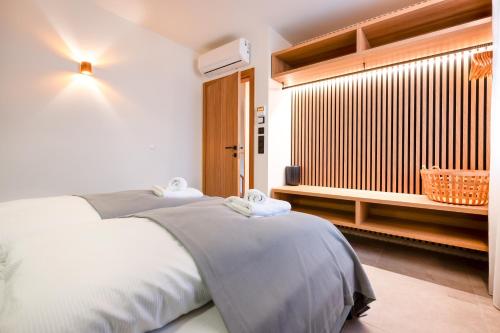 a bedroom with two beds and a window at Residence Smržovka - Luxury House with Swimming Pool, Jacuzzi, Garden and BBQ in Jablonec nad Nisou