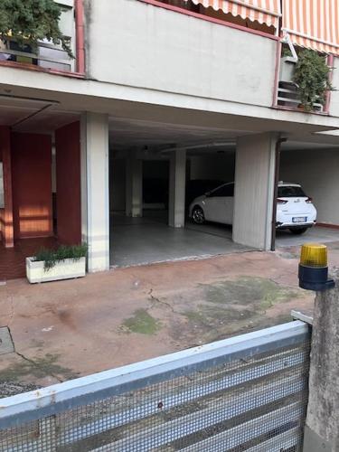 a parking lot with a car parked in a garage at Apartment Montecatini-Terme near Firenze, Lucca, Pisa in Montecatini Terme