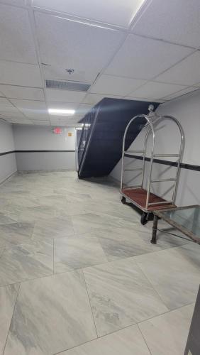 an empty room with a staircase in a building at Town Inn in Bordentown