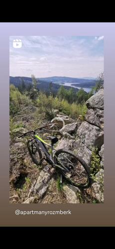 a bike laying on top of a rocky hill at Apartmán s terasou a výhledem na jezero Lipno in Kovářov