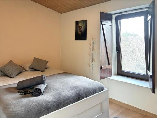 a bedroom with a bed and a window at Retiro de Gondramaz - All house 200 m2 in Gondramaz
