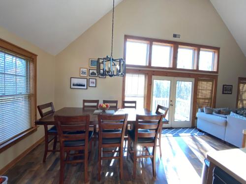a dining room with a table and chairs at Gorgeous House in Camelback Mountain near lifts! in Tannersville