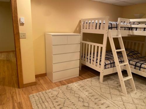 a bedroom with a bunk bed and a ladder at Gorgeous House in Camelback Mountain near lifts! in Tannersville