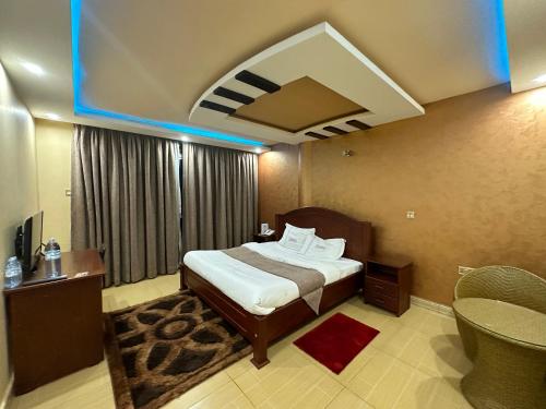 Kampala Executive Suites 객실 침대