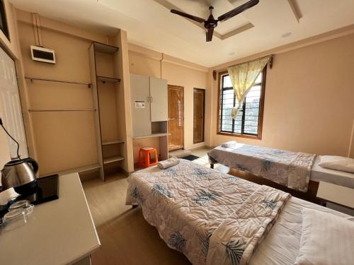 Cama o camas de una habitación en Hotel Dinthar Zara