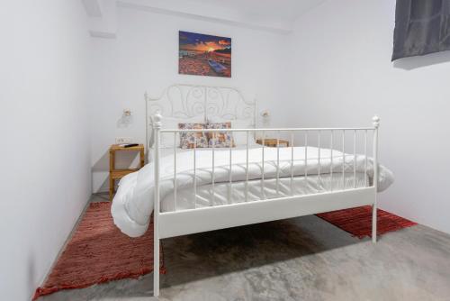 Una cama o camas en una habitación de Ikiesnafplio