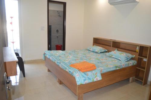 A bed or beds in a room at Ananta Square - Rishikesh 2BHK