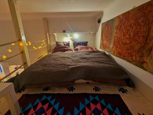 a bedroom with a large bed in a room at Gallery flat in Party district in Budapest