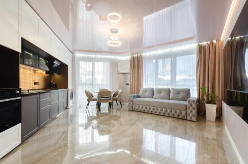 a living room with a couch and a table at 13109 Cozy apartment nearby with Kiev Central Railway Station in Kyiv