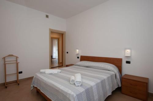 Postel nebo postele na pokoji v ubytování VERDEMARE Rialto