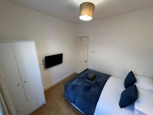 Krevet ili kreveti u jedinici u objektu Spacious Central Brighton Apartment
