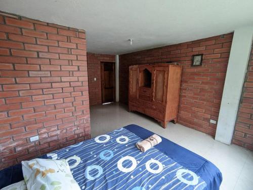 Voodi või voodid majutusasutuse Baños de Agua Santa- habitación toas
