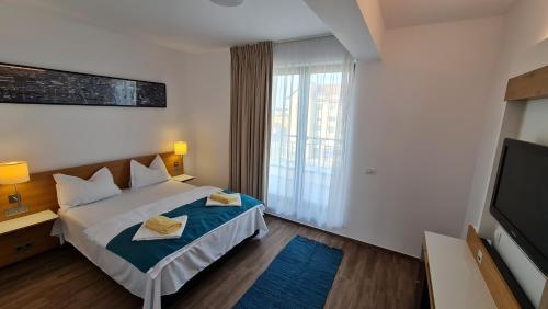 Postel nebo postele na pokoji v ubytování Jafar Resort 9 Penthouse