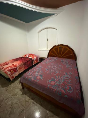 מיטה או מיטות בחדר ב-Los gringos del caribe