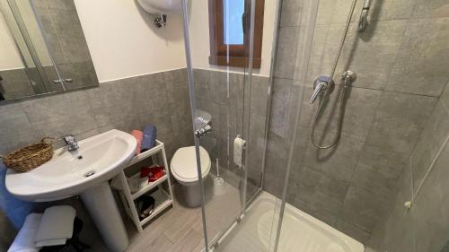 a bathroom with a shower and a sink at Flowers & Angels Home in Santa Maria degli Angeli