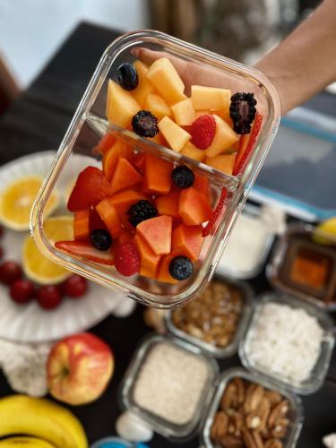 a glass container filled with fruit on top of a table at Hotel Jaiba Mahahual - Adults Only in Mahahual