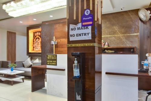 a no waste no entry sign in a hotel lobby at Capital O 82561 Hotel Om Palace in Bhopal