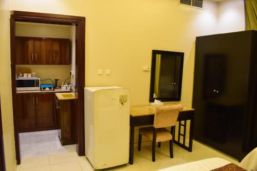 Kuchyň nebo kuchyňský kout v ubytování Arjan Qurtuba Served Apartments