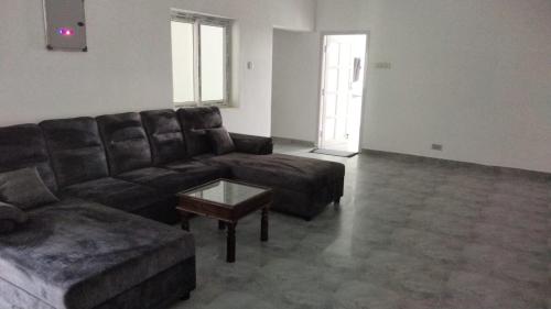 a living room with a couch and a coffee table at Coastal Heaven Koovathur in Kūvattūr