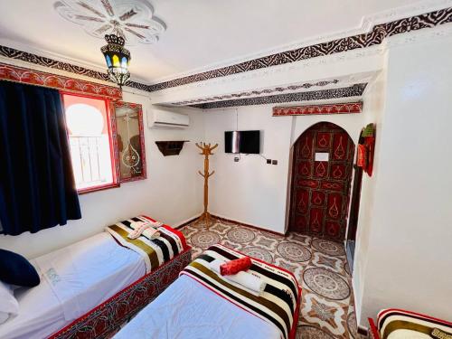 Letto o letti in una camera di Hotel Chefchaouen