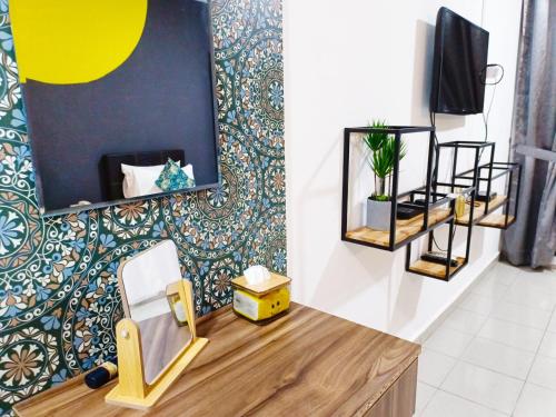 a dressing room with a mirror and a chair at Salaam Suites Hotel in Kota Bharu