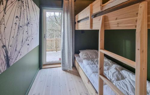 a bedroom with a bunk bed and a window at 3 Bedroom Gorgeous Home In Ullared in Ullared