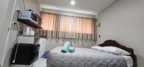 Ένα ή περισσότερα κρεβάτια σε δωμάτιο στο Whitehorse Inn