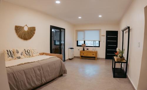 a bedroom with a bed and a desk in it at Casa Cornu in San Rafael