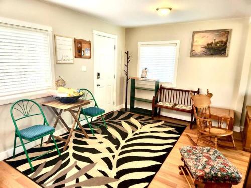 a room with chairs and a zebra rug at Bluewater Delight in Sarnia