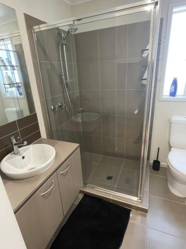 a bathroom with a shower and a sink at Elegant master bedroom with private bathroom in Point Cook