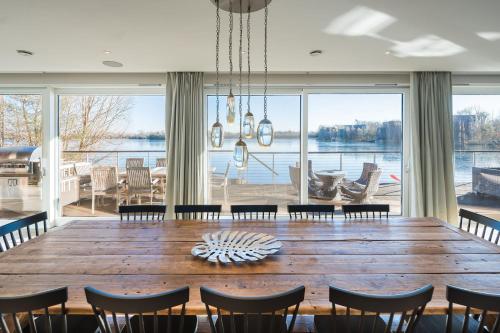 a dining room with a large wooden table and chairs at 10 Bowmoor Edge By Birch Stays 