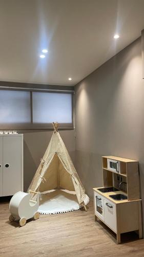 a room with a play room with a tent in it at 私美宅居 in Zhushan